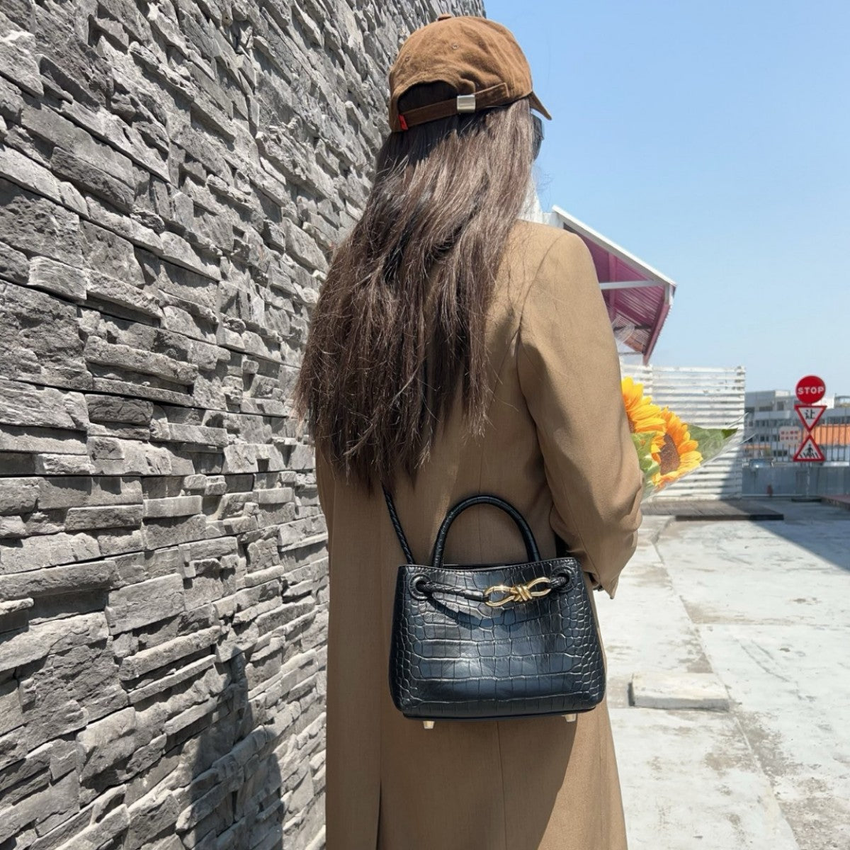 black leather crocodile handbag,women,model display